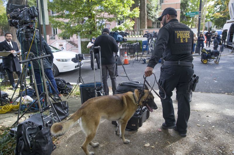 An officer with the Uniform Division of the United States Secret Service uses his dog to search a checkpoint near the home of President Barack Obama. (Photo: AP)