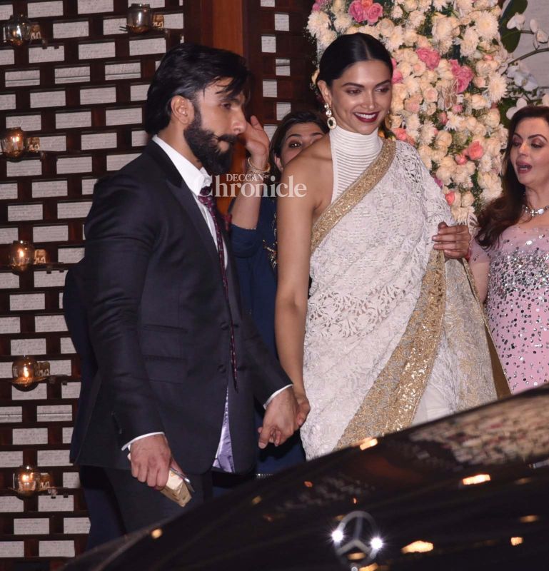 Ranveer guided Deepika out of the bash.