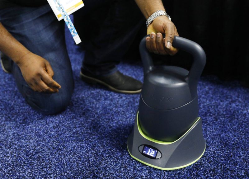 The KettlebellConnect is on display at the Jaxjox booth during CES Unveiled at CES International, Sunday, Jan. 6, 2019, in Las Vegas. (AP Photo/John Locher)