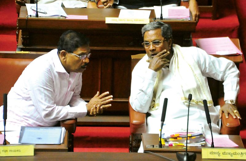 CM Siddaramaiah and Home Minister Dr G Parameshwar in conversation during the Council session 