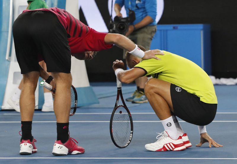 The fourth seed Stanislas Wawrinka, however, quickly jumped over the net to offer his apologies as Martin Klizan sunk to his haunches in pain. (Photo: AP)