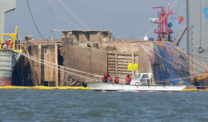 In pics: 6,800-ton South Korean ferry that sank 3 years ago lifted from sea