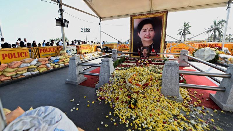 Following the impact of Cyclone Vardah, party workers have kept mud sacks near the burial spot were AIADMK Supremo J Jayalalithaa was laid to rest, adjacent to the MGR Memorial in Chennai. (Photo: PTI)