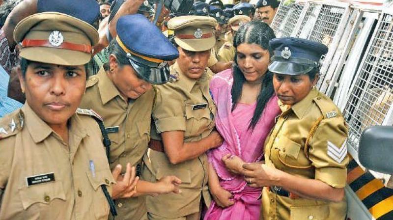 Saritha S Nair being taken away by police