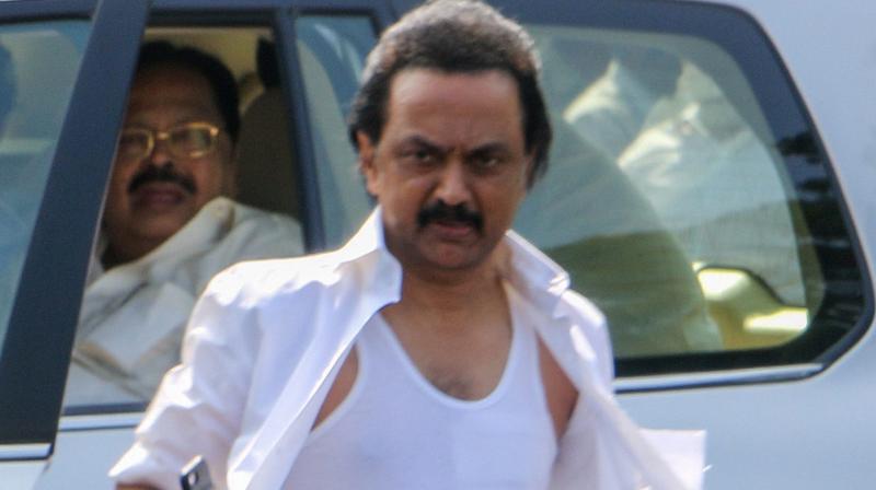 Opposition party leader in Tamil Nadu Assembly, M K Stalin displays his torn shirt after the ruckus experienced during the confidence of vote was taken outside Fort St George in Chennai. (Photo: PTI)