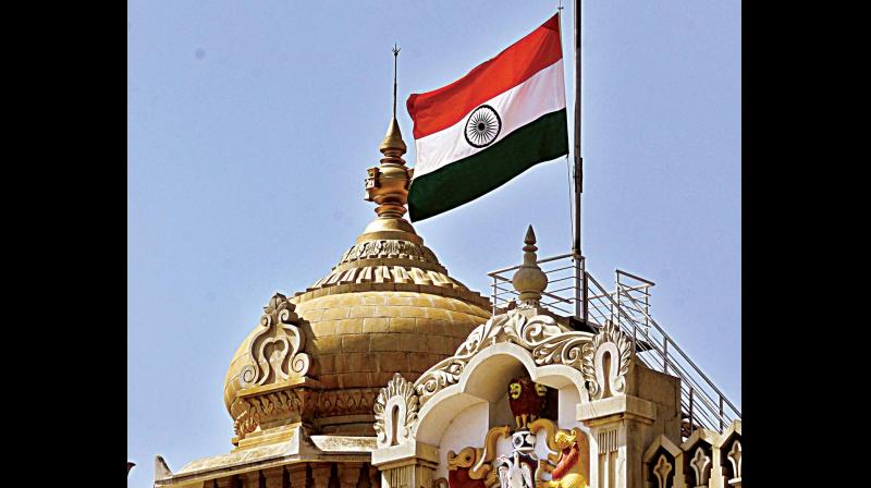 Tricolor at Vidhana Soudha flies half-mast to mourn the death of Co-operation  Minister H.S. Mahadev Prasad, who passed away in Chikkamagaluru on Tuesday. (Photo: DC)