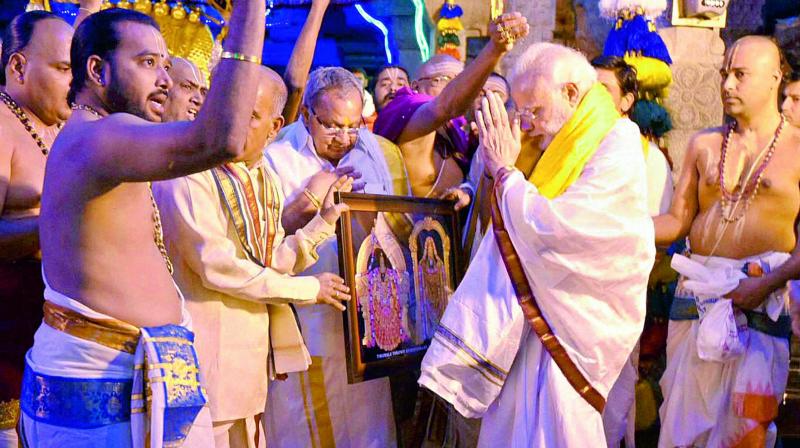 Prime Minister Narendra Modi being blessed by pundits after he offered prayers at the Sri Venkateswara Swamy temple in Tirupati on Tuesday. (Photo: PTI)
