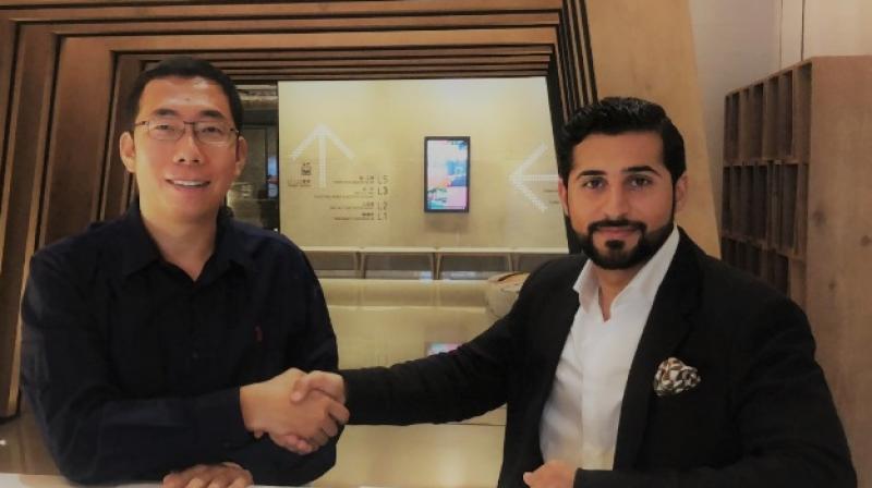Founder and CEO of Xender, Mr. Peter Jiang with the Head of AYGL Group, Mr. Khalifah H. Al-Yaqou, in Beijing