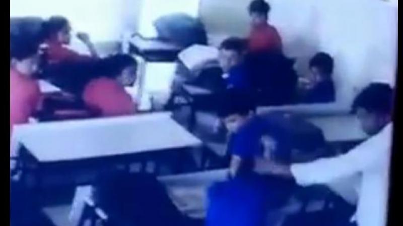 In the video, the teacher, Jagmohan Meena, is seen repeatedly slapping the class 10 student of Swami Vivekanand Model School in Deedwana village. (Photo: YouTube | Screengrab)