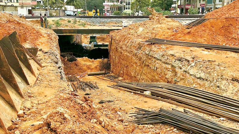 15 months on, the construction of a railway underbridge on TC Palya Main Road is still going on. (Photo: DC)