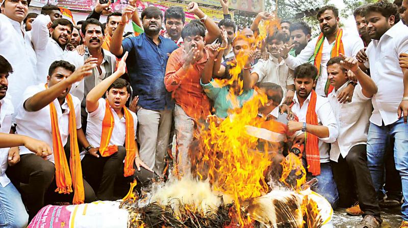 BJP activists stage protest in Bengaluru on Monday against arrest of party MP Pratap Simha and others in Hunsur on Sunday  KPN