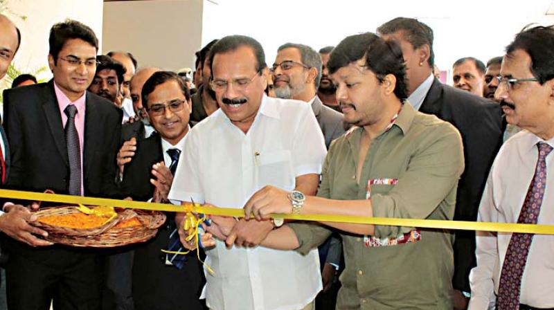 Union Minister Sadananda Gowda and actor Ganesh at the inauguraton of a hospital on the Bengaluru-Tumakuru highway on Tuesday.