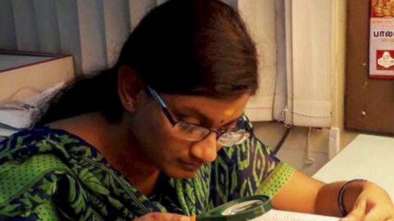 Hailing from Krishnagiri in Tamil Nadu, Dharshana, who has almost nil vision in right eye and partial in left, uses magnifying glass to read. (Photo: File)