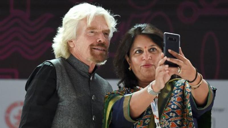 Mumbai CII Presdient Shobana Kamineni takes a selfie with founder of Virgin group Richard Branson during the opening ceremony of the Magnetic Maharashtra Convergence 2018 in Mumbai on Sunday.  (Photo: PTI)