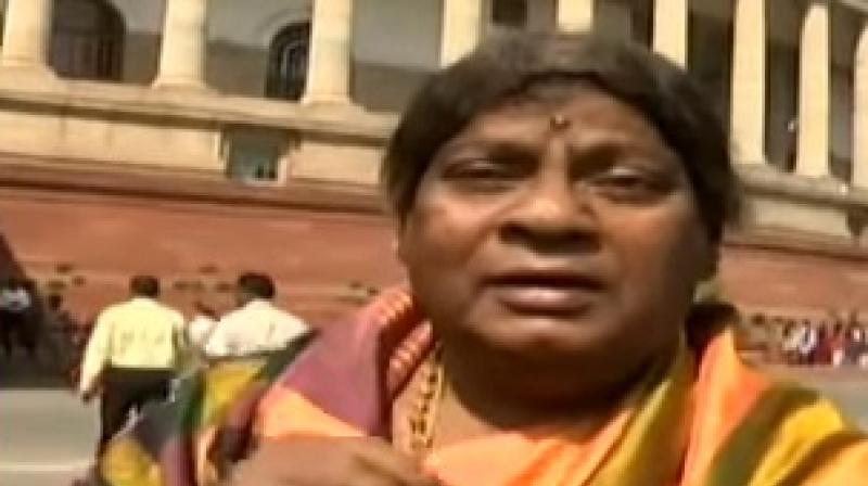 TDP MP Naramalli Sivaprasad wore a yellow silk sari, wig and a flower tucked into it, besides a clean-shaven moustache-less face. (Photo: YouTube Screengrab)