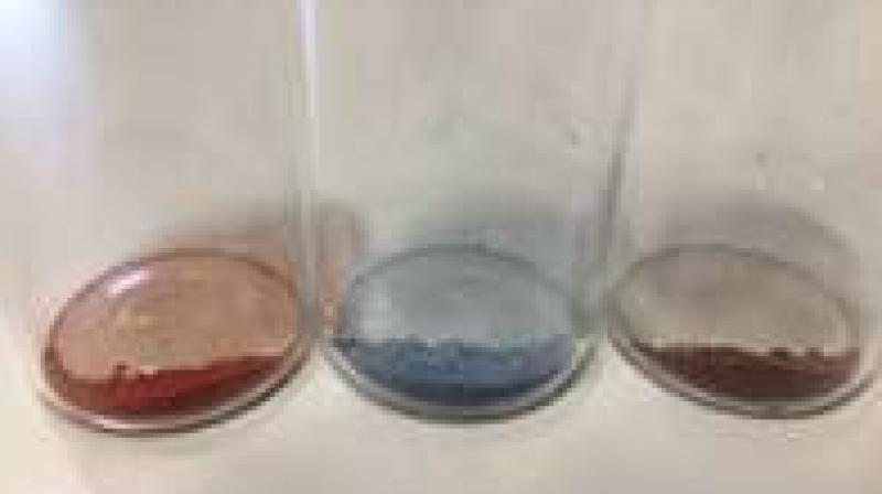 Powders of tantalum nitride nanoparticles (left), tungsten oxide nanowires (centre) and the tantalum nitride/tungsten oxide composite (right). Credit: Daniel Jones/Swansea University.