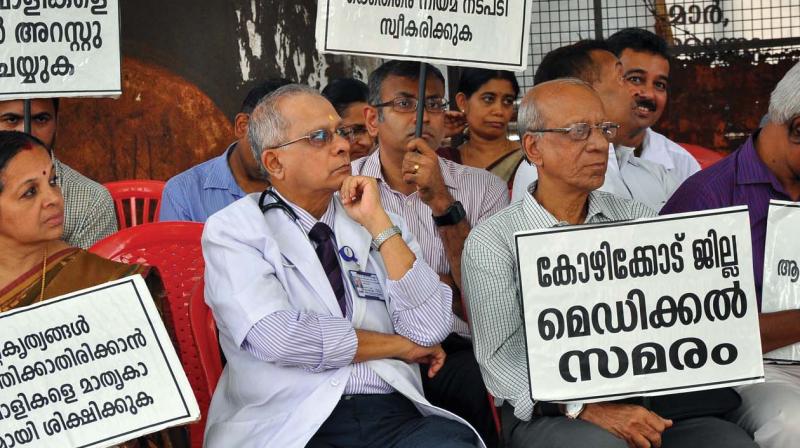 Protesting doctors stage a sit-in in Kozhikode on Wednesday. (Photo: DC)