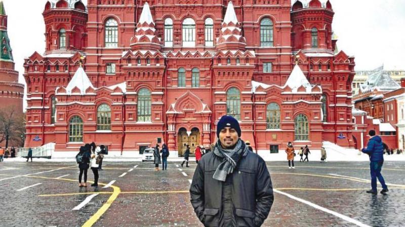 Restaurateur Nikhil Hegde carpooled through Russia and went by road across Europe. Here he poses at the Red Square in Moscow.