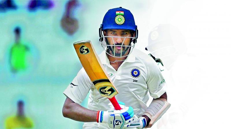 Indian batsman Cheteshwar Pujara in action during the second day of first Test against Sri Lanka at Eden Gardens in Kolkata on Friday. (Photo: PTI)