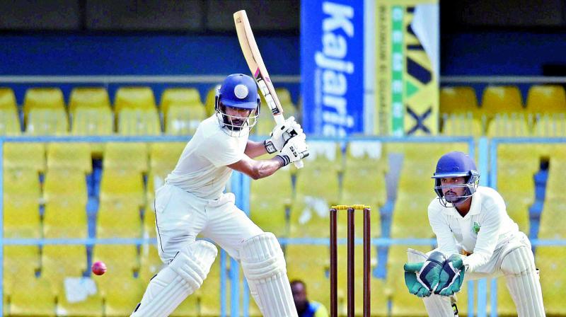 Hyderabads B. Sandeep plays a shot during his knock of 84 on the 1st day of the Ranji trophy cricket match against Assam, at ACA Stadium Barsapara. (Photo: PTI)