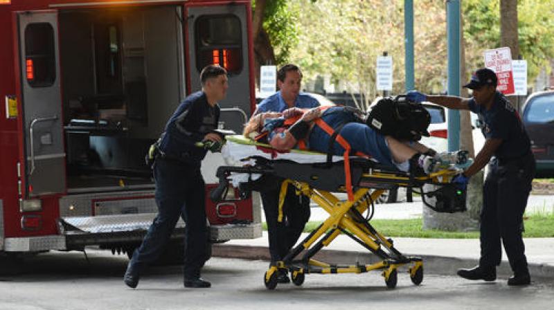 An injured woman is taken into Broward Health Trauma Center in Fort Lauderdale, Fla., after a shooting at the Fort Lauderdale-Hollywood International Airport. (Photo: AP)