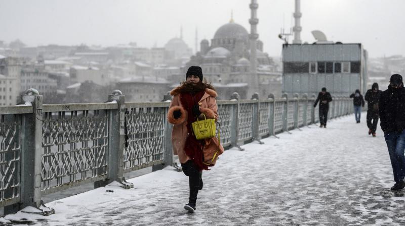 For those not travelling, the snow however provided a rare chance to see Istanbuls famous minaret and dome-studded skyline caked in a white layer of snow. (Photo: AP)