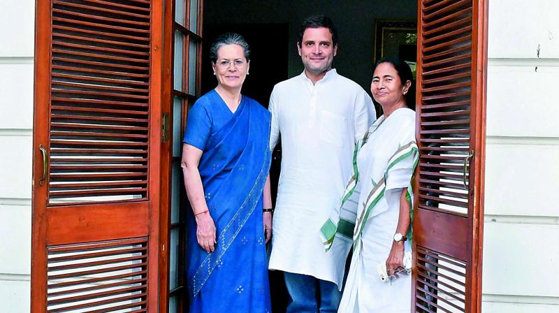 West Bengal CM Mamata Banerjee meets Congress President Sonia Gandhi and party vice-president Rahul Gandhi in New Delhi on Tuesday. (Photo: PTI)