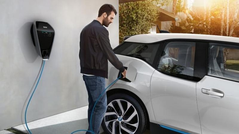 The BMW i3 being charged up using the new smart charging system(Credit: BMW)