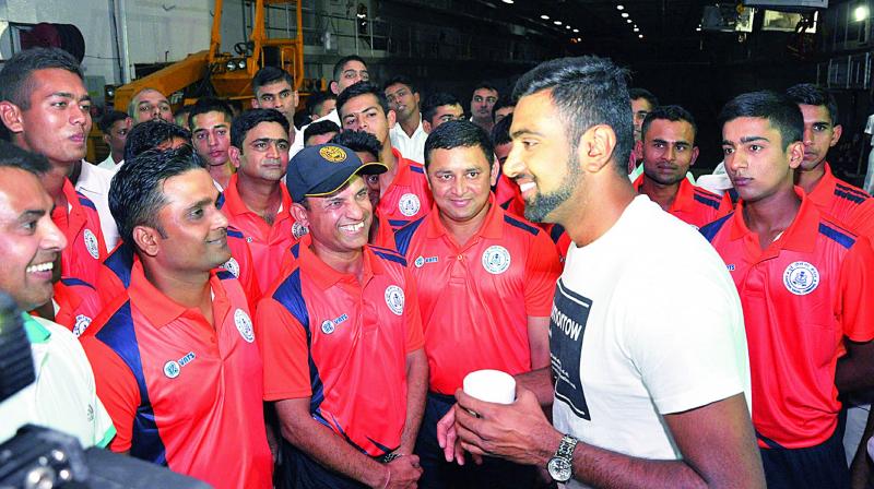 Indian cricketer Ravichandran Ashwin interacts with Navy personnel on board INS Jalashwa during his visit to Eastern Naval Command, in Visakhapatnam on Monday. (Photo: DC)