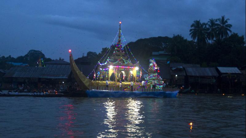 Devotees light lamps to herald Buddhas return at Myanmars Thadingyut Festival