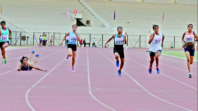 Girls sprinters in action during their 100 meters semifinal round of the National Youth Athletics Championship at the G.M.C Balayogi Stadium at Gachibowli in Hyderabad on Friday.