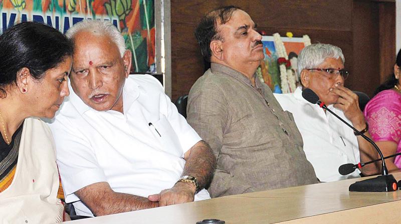 Union ministers Nirmala Sitharaman and H.N. Ananth Kumar, state BJP president B.S. Yeddyurappa and MP Shobha Karandlaje at a meeting to mourn party leader Vimala Gowda in Bengaluru on Sunday. (Photo: KPN)