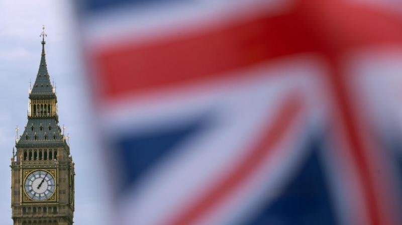 File photo taken in December 2016 shows a British Union flag flying near the Elizabeth Tower, otherwise known as Big Ben, opposite the Houses of Parliament in central London. (Photo: AFP)