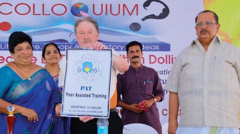 Jonathan Dollimore releases the logo during an international colloquium at M.S.M College, Kayamkulam, on Wednesday. College principal Dr. S.Amina is beside him.