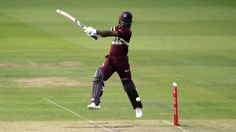 Evin Lewis struck 58 off 26 balls, including five sixes and as many fours in a West Indies total of 199 for four with Marlon Samuels contributing 43 and Denesh Ramdin 44 not out. (Photo: AP)