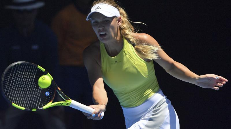 Caroline Wozniacki  saved two match points and rallied from 5-1 down in an epic third set to keep her dream of a first Grand Slam title alive.