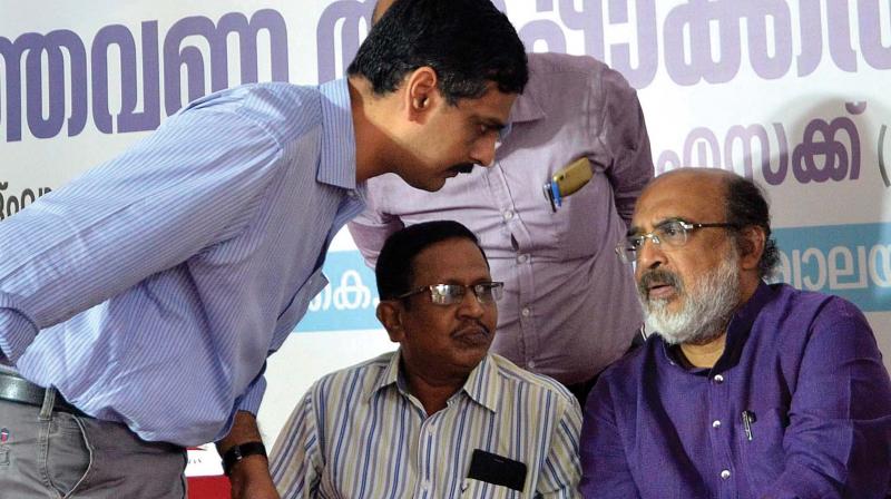 Finance minister T.M. Thomas Isaac shares words with KFC general Manager Premnath Ravindranath and Js (Rtd) Satheesh Chandrababu during the inauguration of KFC adalath on Tuesday in Thiruvananthapuram.(Photo: DC)