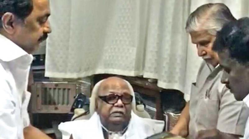 DMK working president M. K., Stalin presents his father and DMK party chief with a special book to mark his birthday. (Photo: DC)