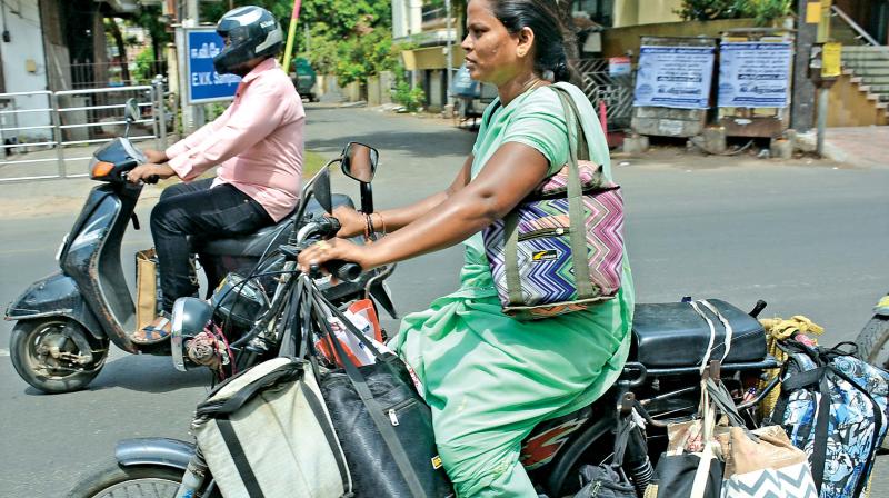 One of the women dabbawala carrying lunch boxes for delivery in the city. (Photo: DC)