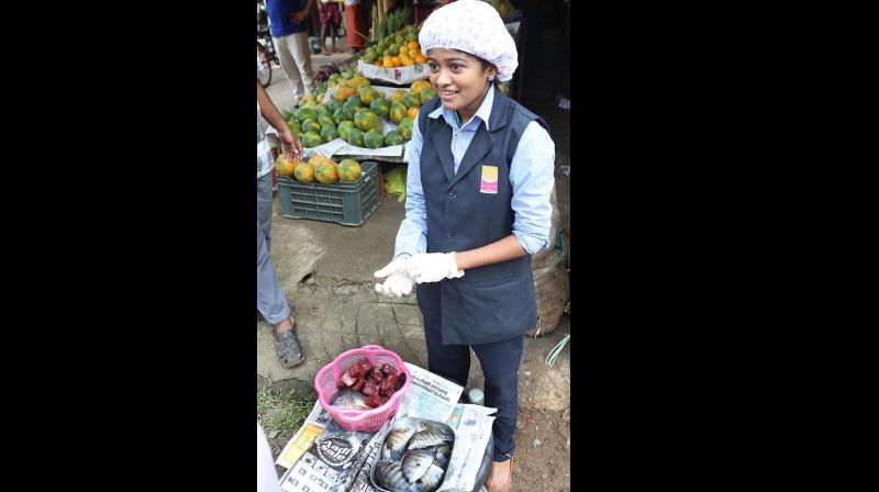 Sharing a picture of Hanan selling fish in her college uniform on his Facebook page, Vijayan said he was proud of the student and the government was with her. (Photo: Facebook)
