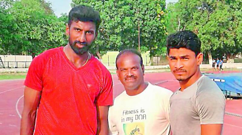 Premkumar (from left), Ramesh and Sudhakar pose before training session.