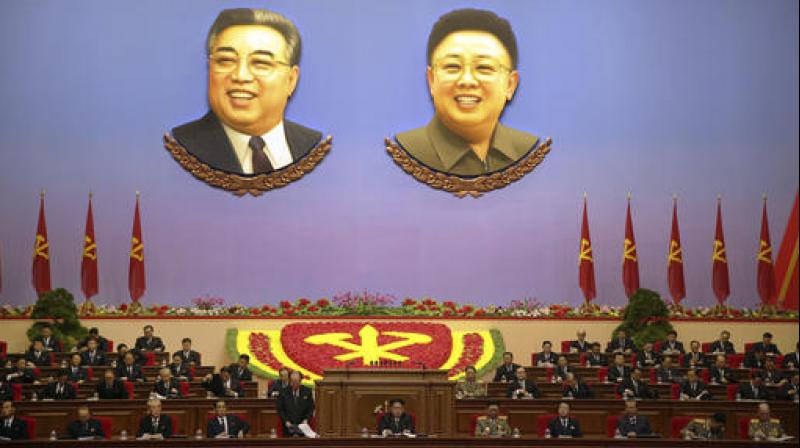 The portraits of late North Korean leaders Kim Il Sung, left, and Kim Jong Il hang inside the convention hall of the April 25 House of Culture where the party congress is held in Pyongyang, North Korea. ruling-party congress announced a new title for party chairman Kim Jong Un, center, in a move that highlights how the authoritarian countrys first congress in 36 years is aimed at bolstering the young leader. (Photo: AP)