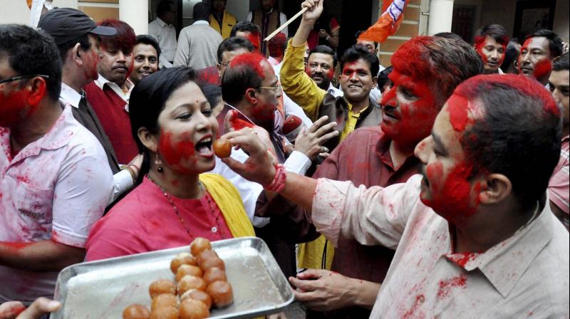 BJP supporters celebrate the partys victory in Uttar Pradesh and Uttarakhand, Manipur and Goa elections in Guwahati. (Photo: PTI)