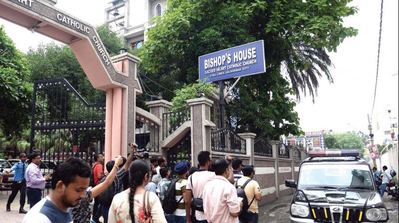 Mediapersons gather near Bishops House in Jalandhar on Monday. (Photo: AFP)