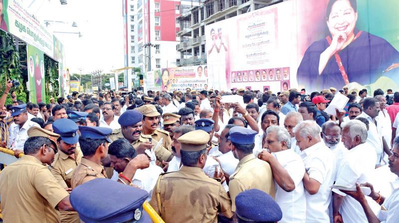 Police check the cadres outside the venue of the AIADMK general body meeting at Vaanagaram on Tuesday. (Photo: DC)
