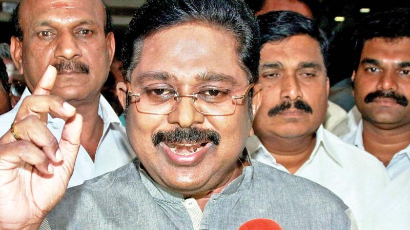 AIADMK (Amma) deputy general secretary TTV Dhinakaran, along with his supporters, addressing a press conference in Madurai on Monday (Photo: AP)