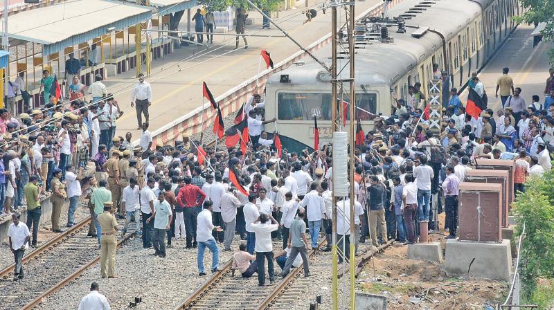 Members of DMK and other political party cadres stage a rail roko against the Centre over the Cauvery conflict at Perambur railway station on Monday. (Photo: DC)