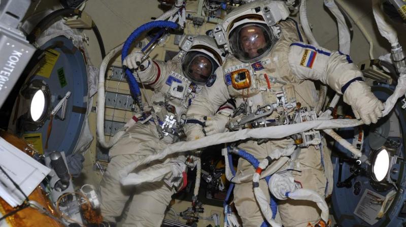 Cosmonauts Fyodor Yurchikhin (left) and Sergey Ryazanskiy are pictured in the Orlan spacesuits they are wearing during todays spacewalk. Credit: @SergeyISS