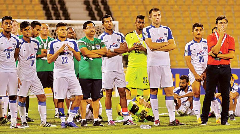 A dejected BFC team looks on after losing the AFC Cup final.
