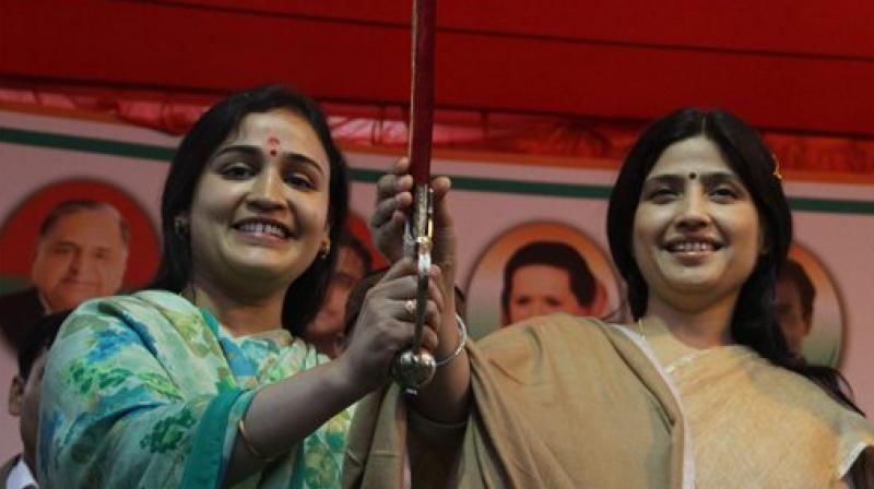SP MP and Dimple Yadav and SP candidate Aparna Yadav at an election rally in Lucknow. (Photo: AP)